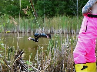 Lezdom babe in erotic anal domination by a quiet serene river