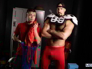 Towel boy Ryan Bailey checks out Travis Connor's pack in the locker room