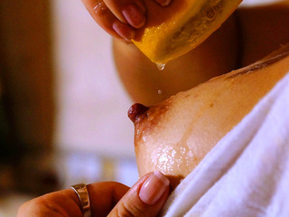 Annie teasing herself with an orange