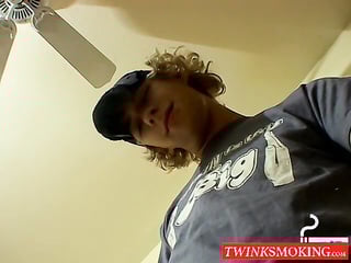 Blonde twink Casey Wood jerks off his dong while smoking