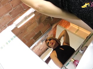 Blonde tgirl in ebony stockings peeing on her own feet