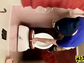 Devin Reynolds grabs his cock and unloads in the toilet