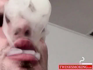 Tattooed skinny dude smoking and shooting cum on the floor