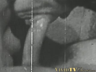 Black and white vintage video of lady sucking her lover