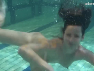 Babes swim strip and have fun underwater