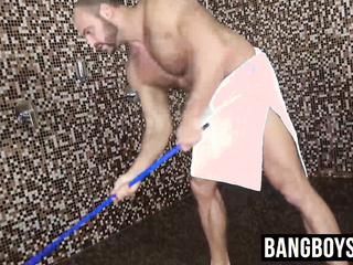 Man with muscles is stroking his giant dick under the shower