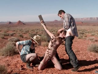Deviant couple torment babe in desert