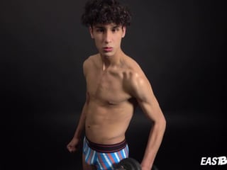 Curly twink boy shows off his slim body on webcam